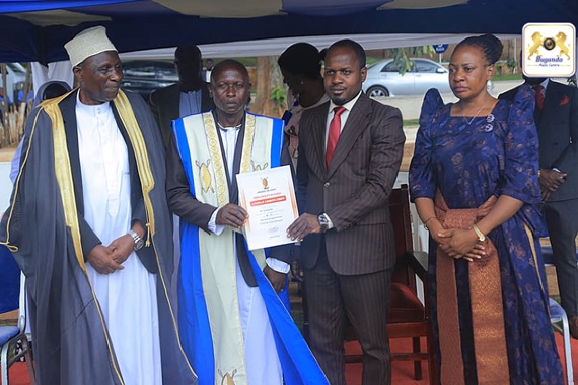 Buddu County's generous contribution towards Oluwalo Initiative being received by Hon Kazibwe on behalf of the Katikkiro